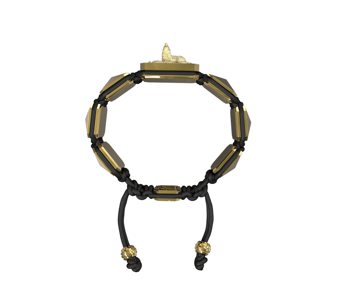 Selfmade bracelet with ceramic and sculpture finished in 18k Yellow Gold complemented with a black coloured cord.