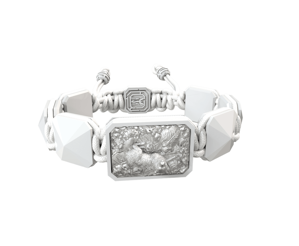 Selfmade bracelet with white ceramic and sculpture finished in a Platinum effect complemented with a white coloured cord.