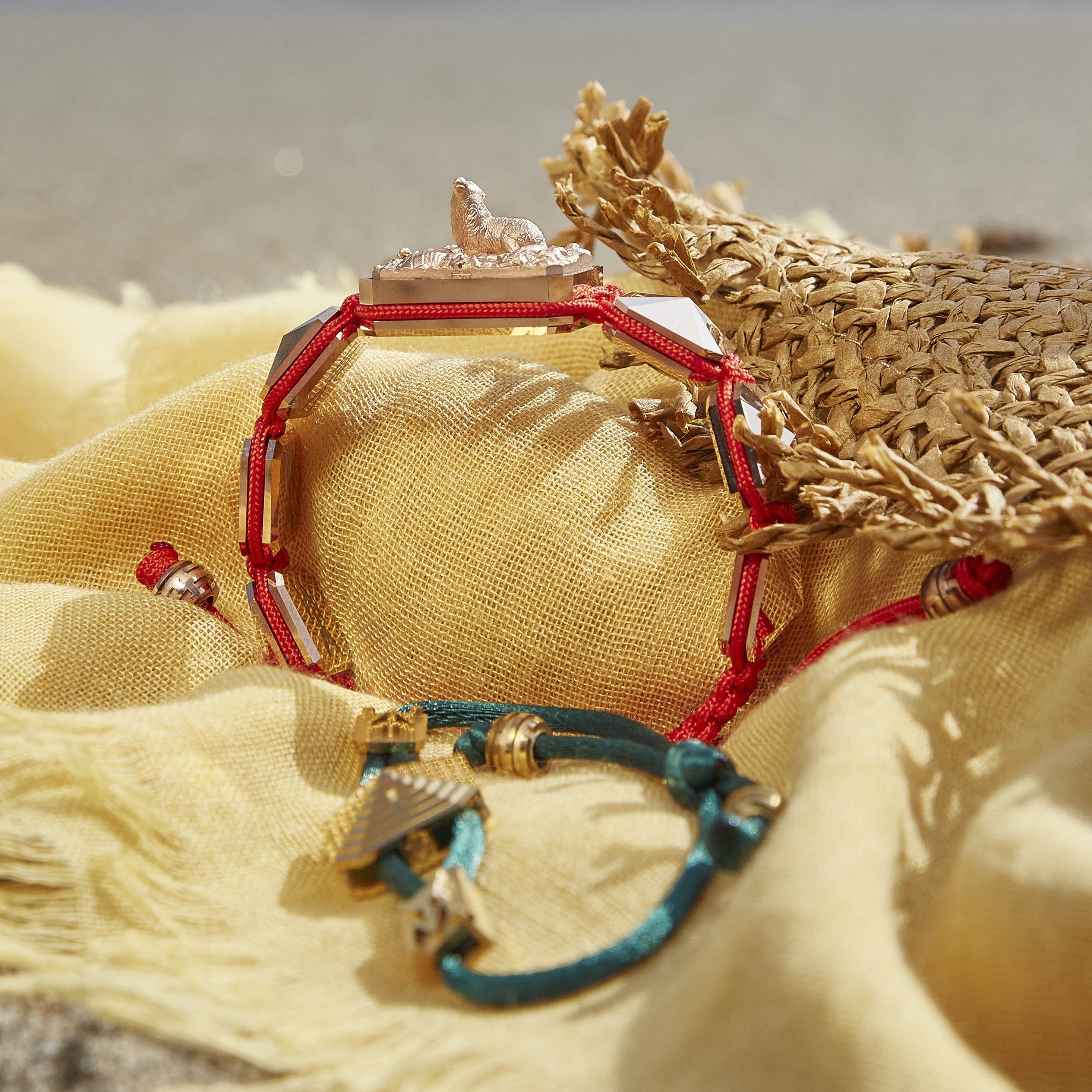 Selfmade bracelet with ceramic and sculpture finished in 18k Rose Gold complemented with a red coloured cord.