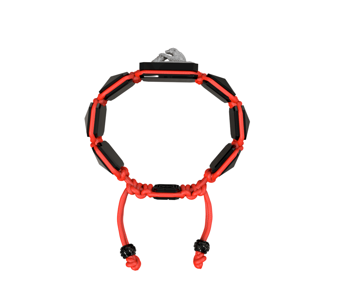 Proud Of You bracelet with black ceramic and sculpture finished in anthracite color complemented with a red coloured cord.
