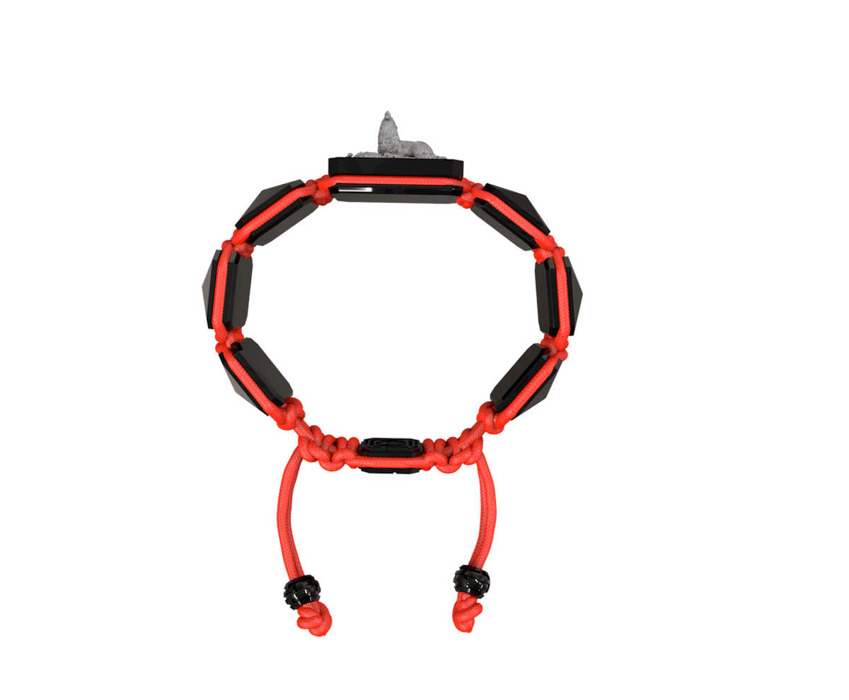 Selfmade bracelet with black ceramic and sculpture finished in anthracite color complemented with a red coloured cord.