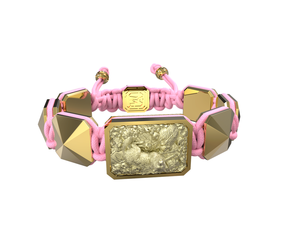 Selfmade bracelet with ceramic and sculpture finished in 18k Yellow Gold complemented with a pink coloured cord.
