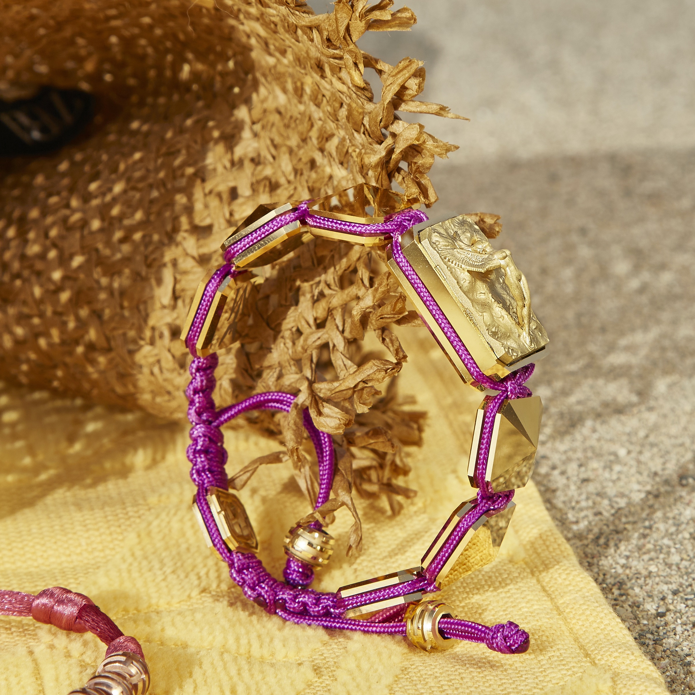 Miss You bracelet with ceramic and sculpture finished in 18k Yellow Gold complemented with a violet coloured cord.
