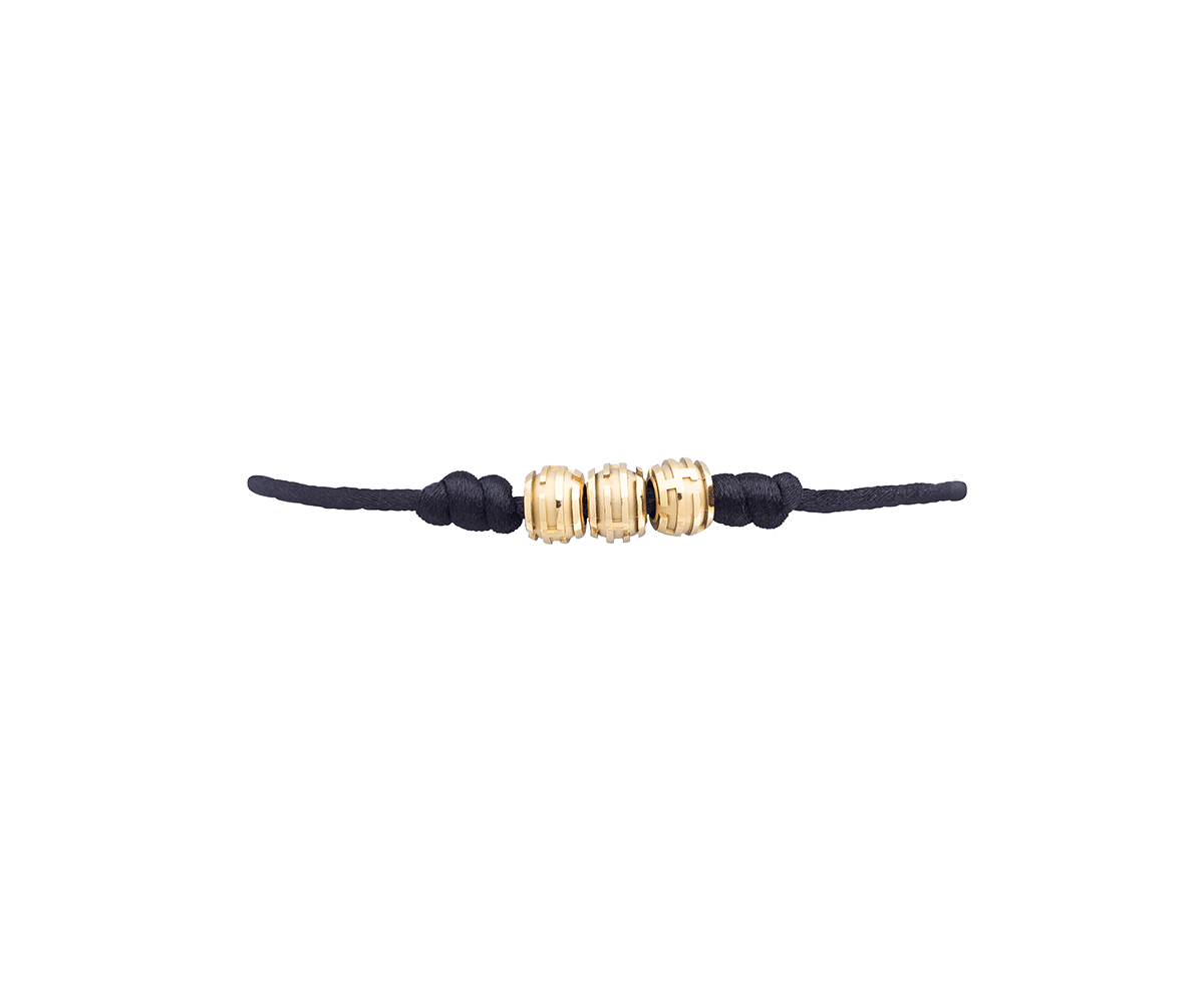 Maze Earth Bracelet finished in Yellow Gold. Carved in ceramics. Black thread.