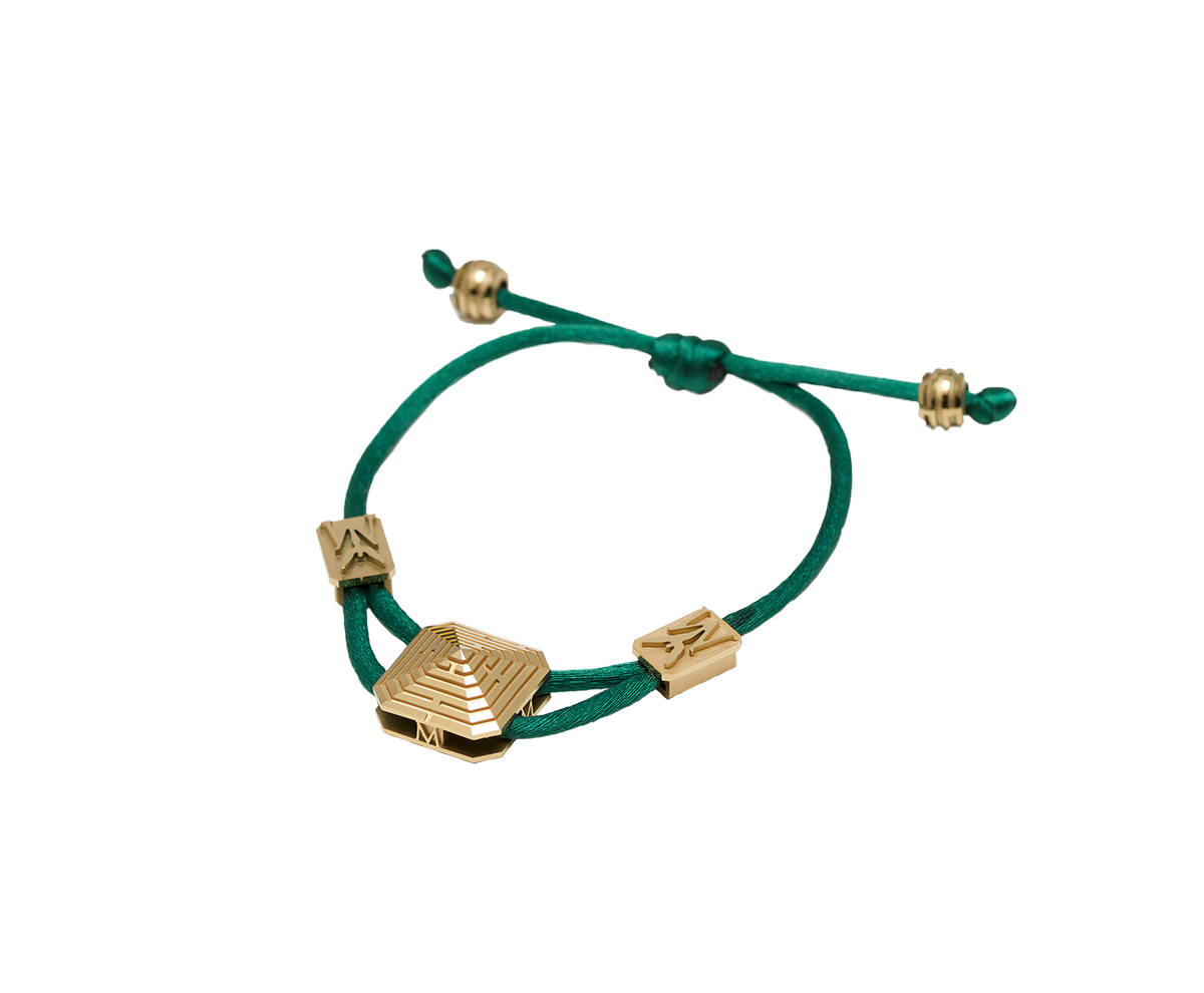 Maze Pyramid Bracelet finished in Yellow Gold. Carved in ceramics. Green thread.
