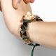 Miss You bracelet with ceramic and sculpture finished in 18k Yellow Gold complemented with a green coloured cord.