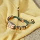 I Love Me bracelet with ceramic and sculpture finished in 18k Rose Gold complemented with a dark green coloured cord.