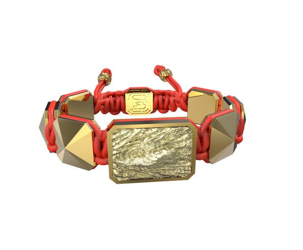 Shop I'm Different bracelet with ceramic and sculpture finished in 18k Yellow Gold complemented with a red coloured cord.