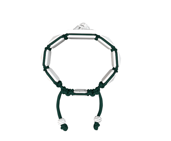 Shop Proud Of You bracelet with white ceramic and sculpture finished in a Platinum effect complemented with a dark green coloured cord.